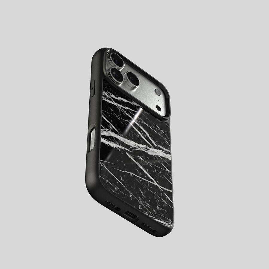 iPhone case in real Nero Marquina marble, angled rear view with the camera cut-out