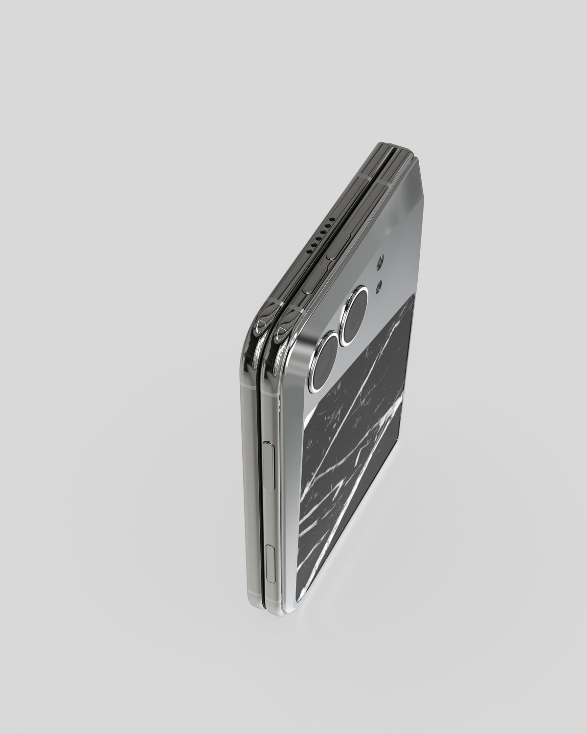 Marble Fusion Snap Nero Marquina on the closed iPhone Duo, upright from above with cameras and marble veneer