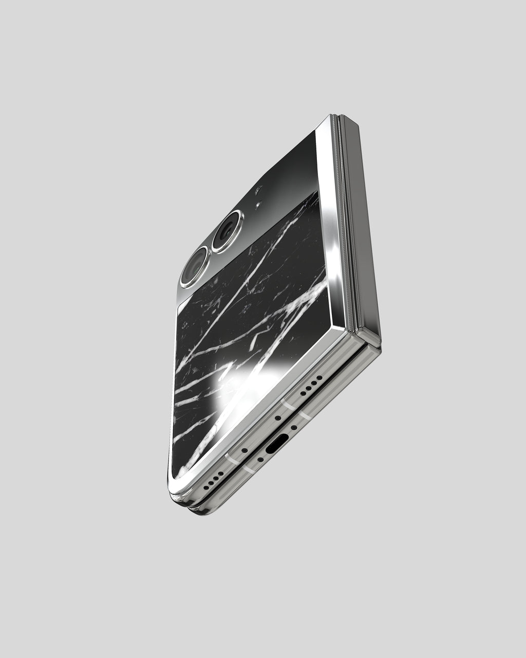 Marble Fusion Snap Nero Marquina on the closed iPhone Duo, seen from below with port and speaker
