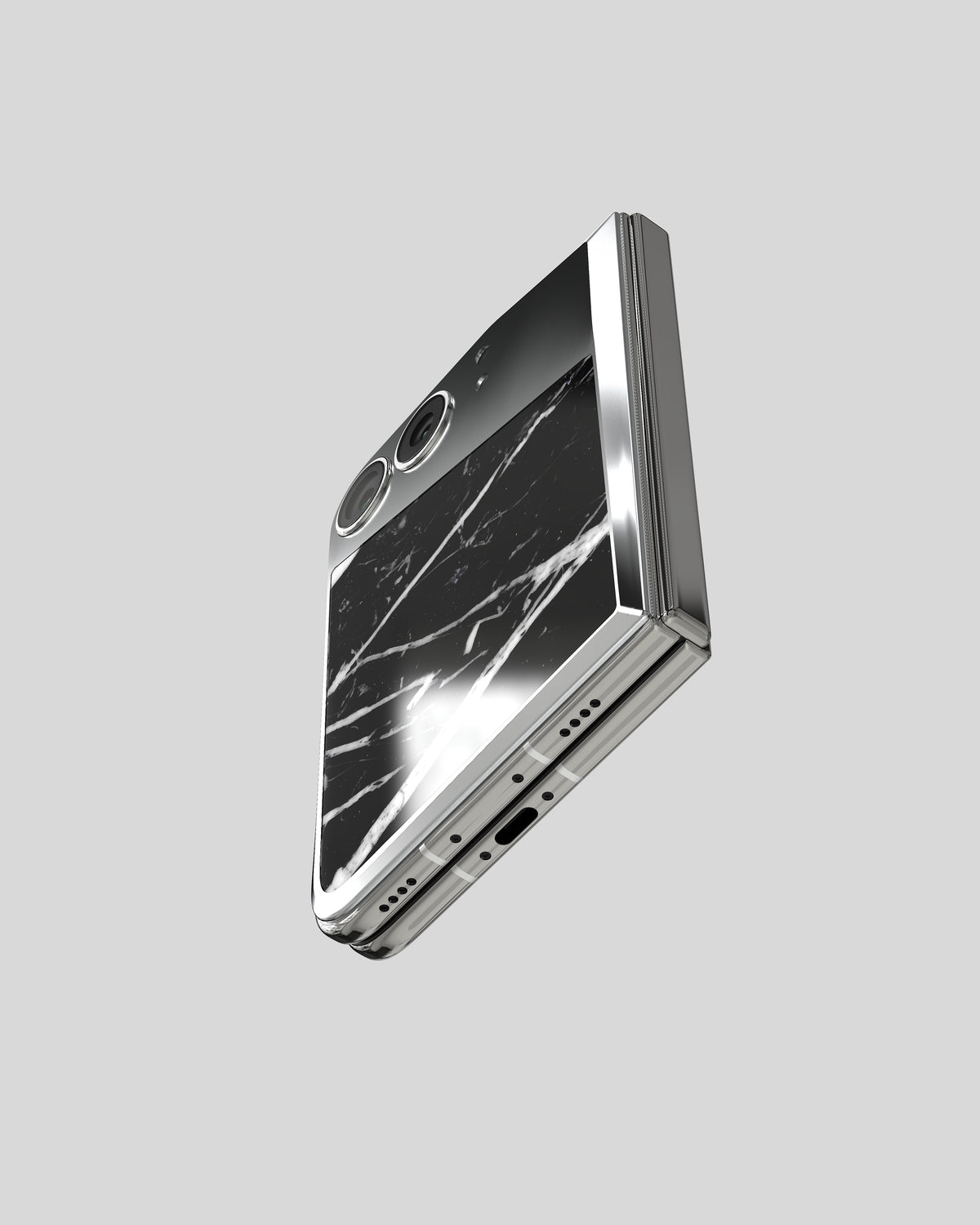 Marble Fusion Snap Nero Marquina on the closed iPhone Duo, seen from below with port and speaker