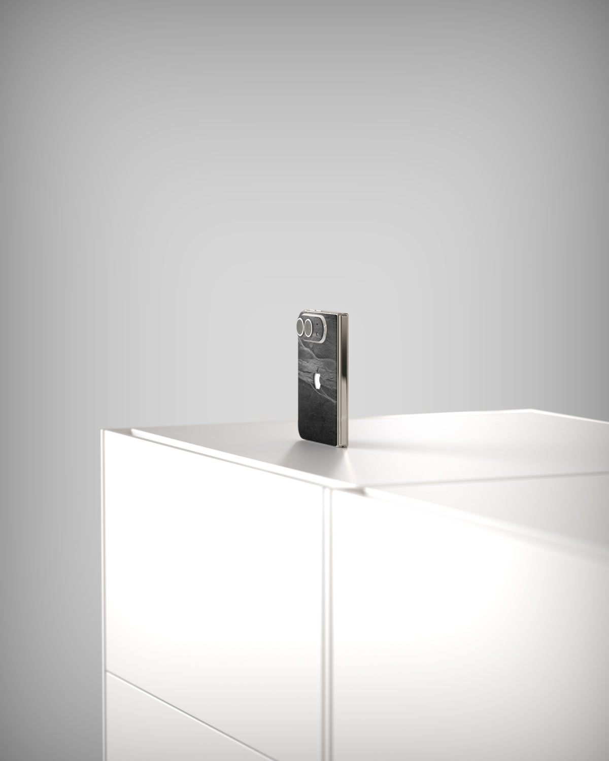 iPhone Duo with the Slate Skin Black Rock on a white sideboard